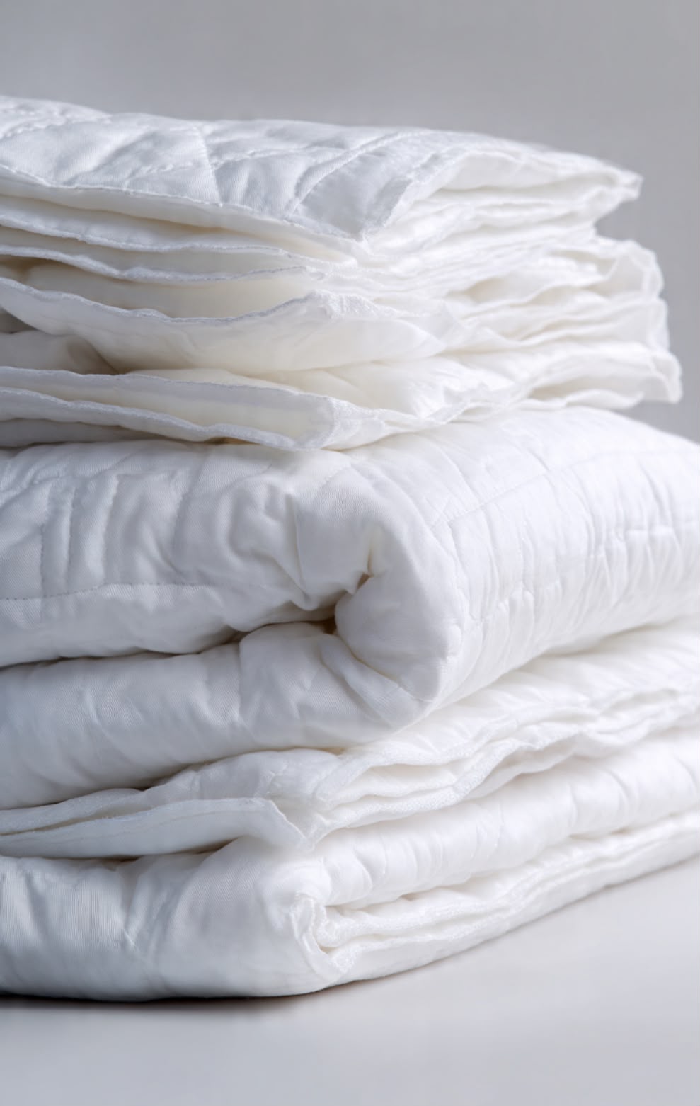 Stacked wholesale cotton duvets and comforters